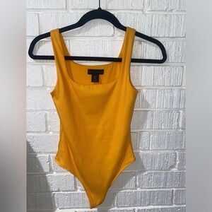 House of Harlow Orange ribbed bodysuit.